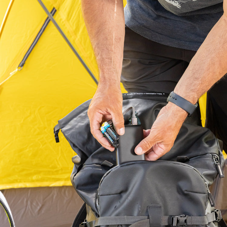 Person using Paleblue VIVID Ridgeline USB rechargeable batteries while camping