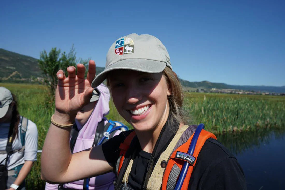 Smiling girl with a baseball cap