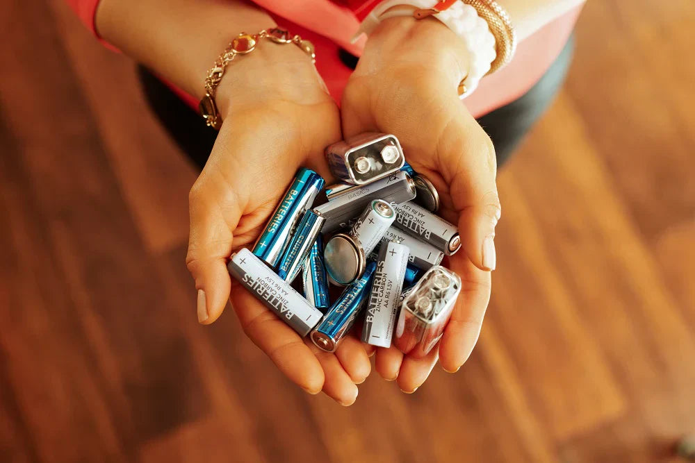Woman holding batteries