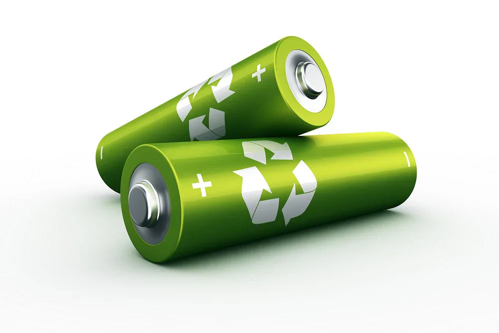 two green batteries for recycling
